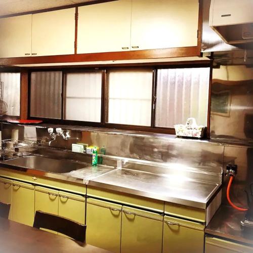 a kitchen with a sink and a counter top at Right nearby world heritage! 2BR Nikko Stay house in Nikko