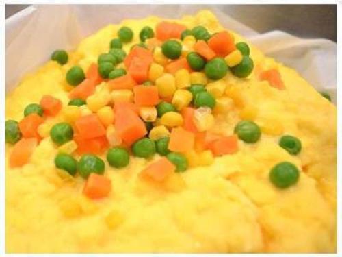 a cake with peas and carrots on top of it at Hotel Green Selec in Sendai