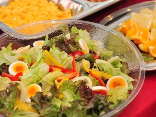 a bowl of salad with eggs and vegetables on a table at Hotel Green Selec in Sendai
