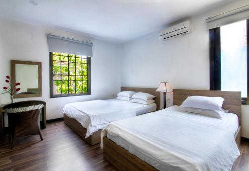Кровать или кровати в номере Ki Nô Homestay