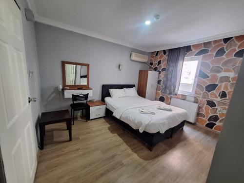 Katil atau katil-katil dalam bilik di Mavikumsal Otel
