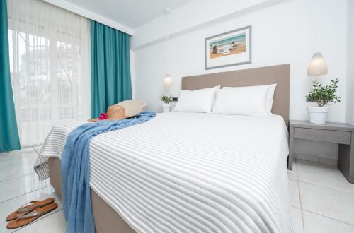 Ένα ή περισσότερα κρεβάτια σε δωμάτιο στο Bitzaro Palace Hotel