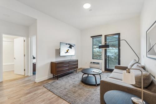 a living room with a couch and a table at Pioche Village Park City in Park City