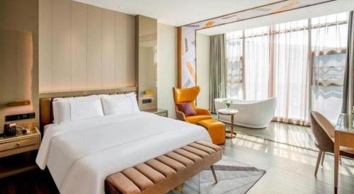 Katil atau katil-katil dalam bilik di Tomeet Hotel