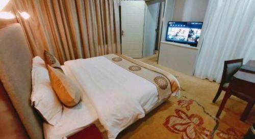 TV a/nebo společenská místnost v ubytování Wanxiang Hotel