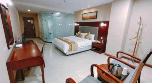 Postel nebo postele na pokoji v ubytování Wanxiang Hotel