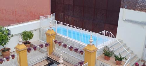 an overhead view of a swimming pool on a building at Las Casas de El Arenal in Seville