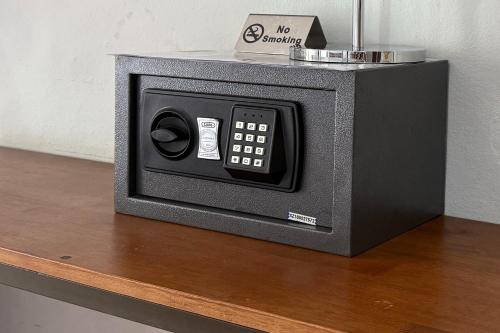 a microwave oven sitting on top of a table at Sabaidee Chiangmai Hotel in Chiang Mai
