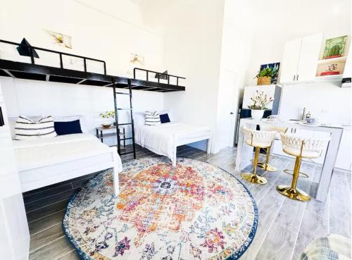 Кровать или кровати в номере Boutique Studio in Laoag City