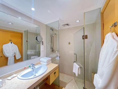 a bathroom with a sink and a shower at Holiday Inn Temple Of Heaven Beijing by IHG in Beijing