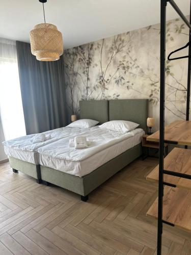 Postel nebo postele na pokoji v ubytování SOLAPART Apartamenty