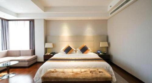 Ένα ή περισσότερα κρεβάτια σε δωμάτιο στο Xian Yohol Hotel
