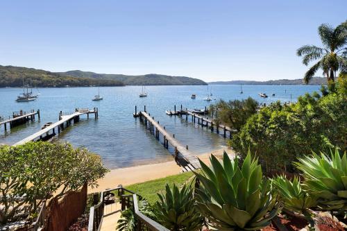 a view of a harbor with boats in the water at Island Paradise - Private Waterfront Retreat in Scotland Island