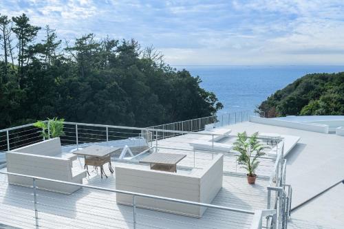 a balcony with a view of the ocean at TAOYA Shirahama Senjyo in Shirahama