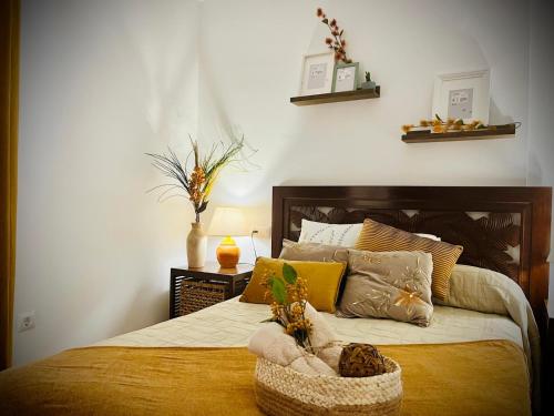 a bedroom with a bed with a basket on it at Lunamar in San José