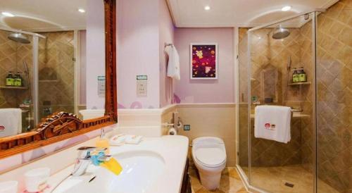 a bathroom with a sink and a toilet and a shower at Hangzhou The First World Hotel in Hangzhou