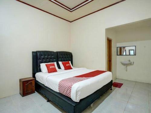 Katil atau katil-katil dalam bilik di Hotel O Efniati Homestay Syariah