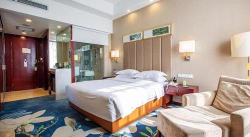 Postel nebo postele na pokoji v ubytování Inzone Garlnd Hotel Zhangqiu
