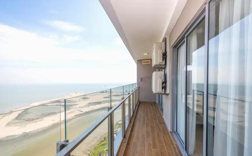 a balcony with a view of the beach at Silverscape Seaview Residence Melaka in Melaka