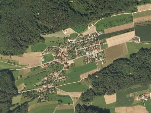 an aerial view of a town with houses and fields at B&B Hersberg in Hersberg