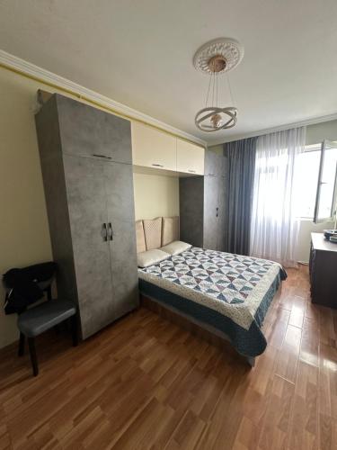 a small bedroom with a bed and a chair at McDonald's in Itʼkhvisi