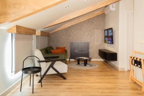 a living room with a couch and a table at Dugi Hotel in Istanbul
