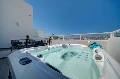 a jacuzzi tub on the roof of a house at Marina Suites & apartments - Self catering - by Tritoni hotels in Il-Gżira