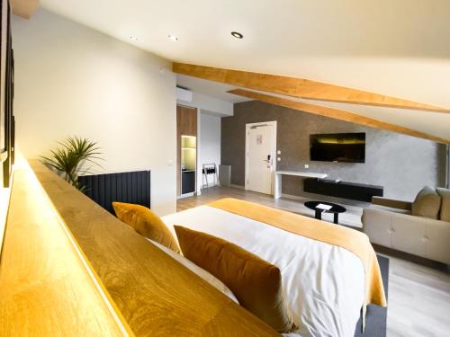 a bedroom with a large bed and a couch at Dugi Hotel in Istanbul