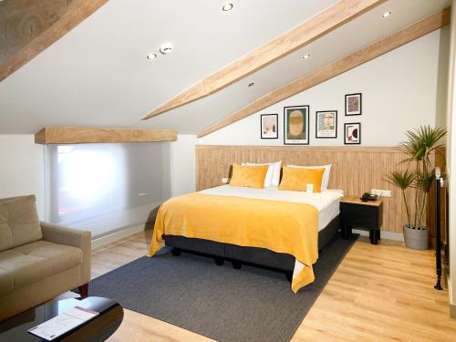 a bedroom with a bed and a couch at Dugi Hotel in Istanbul