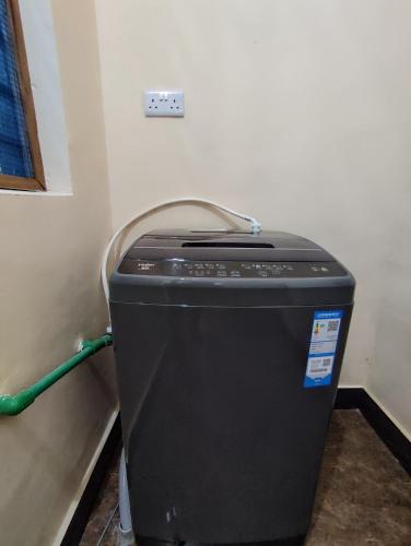 a trash can in the corner of a room at Nearby fumba joy in Dambani
