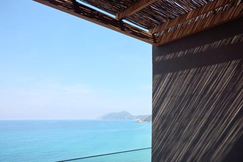 a view of the ocean from a building at Alkyna Lifestyle Beach Resort - Adults Only in Agios Gordios