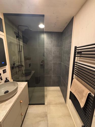 a bathroom with a shower and a sink at Stylish beach house in Privlaka in Privlaka