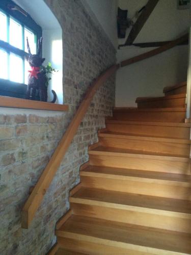 a set of stairs with a teddy bear in a window at Apartment Alte Deckstation in Neustadt