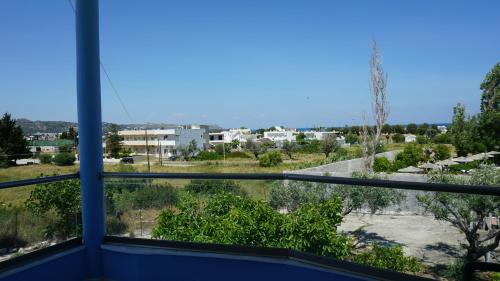 a view of a city from a window at Sugarcubes by Evagstays in Faliraki