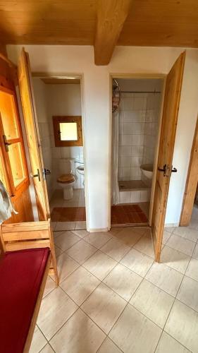 a bathroom with a shower and a toilet in a room at Bungalovy Baranec in Žiar