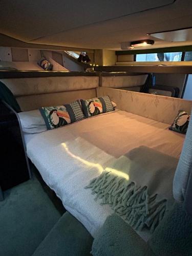 a bed in the back of a boat at barco marismas del sur in Punta Umbría