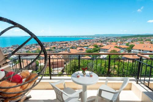 a view of a balcony with a table and chairs at Sea View Hills in Sveti Vlas