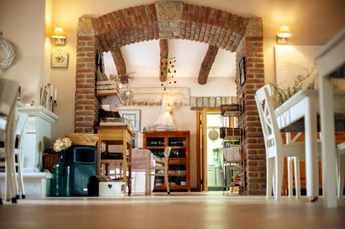 a living room with a fireplace and a brick wall at Masseria Fontana dei Fieri in Pietrelcina