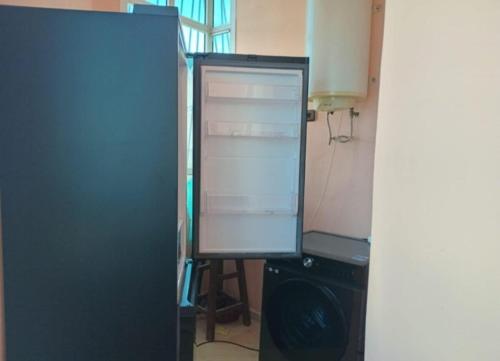 a computer monitor sitting on top of a desk at Appartement confortable en face du complexe scolaire newton in Kenitra
