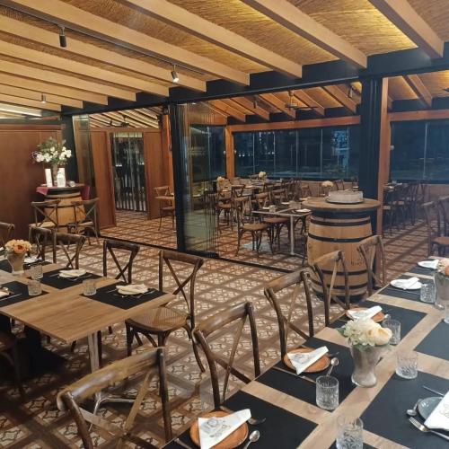 a dining room with tables and chairs in a room at Hostal Casa Pancho in Sangonera La Seca