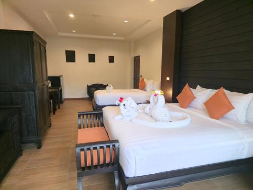 Ένα ή περισσότερα κρεβάτια σε δωμάτιο στο Blue Palm Residence Kata