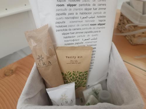 a box of spa products sitting on a table at Relais Tiaré Bed and Breakfast in Bacoli