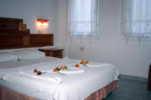 En eller flere senge i et værelse på Agar Apart Hotel