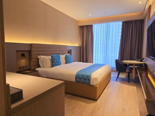 Postel nebo postele na pokoji v ubytování Bayprime Hotel