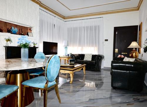 a living room with a table and a couch at Fantastic chalet 5 mins away from the beach by easyBNB in Torremolinos