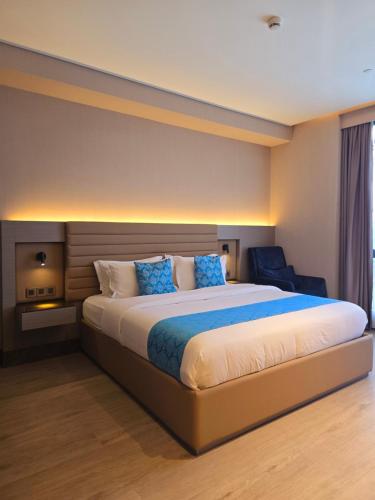 Postel nebo postele na pokoji v ubytování Bayprime Hotel