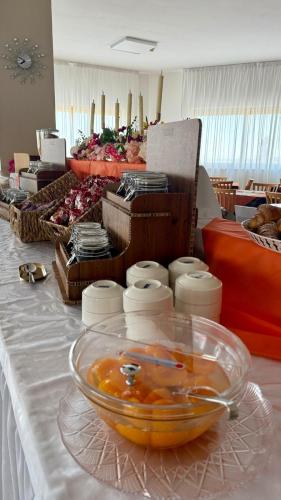 a table with a bowl of food on a table at Ibisco Hotel in Rodi Garganico