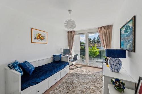 a bedroom with a bed and a desk and a window at Newly Built 4 Bedrooms Property in Vésenaz
