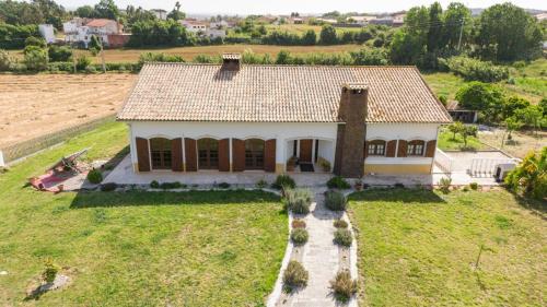 an aerial view of a house in a field at Quinta da Barrosa in Tentúgal