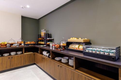 a buffet line with food on display in a restaurant at Casa San Giuseppe in Rome